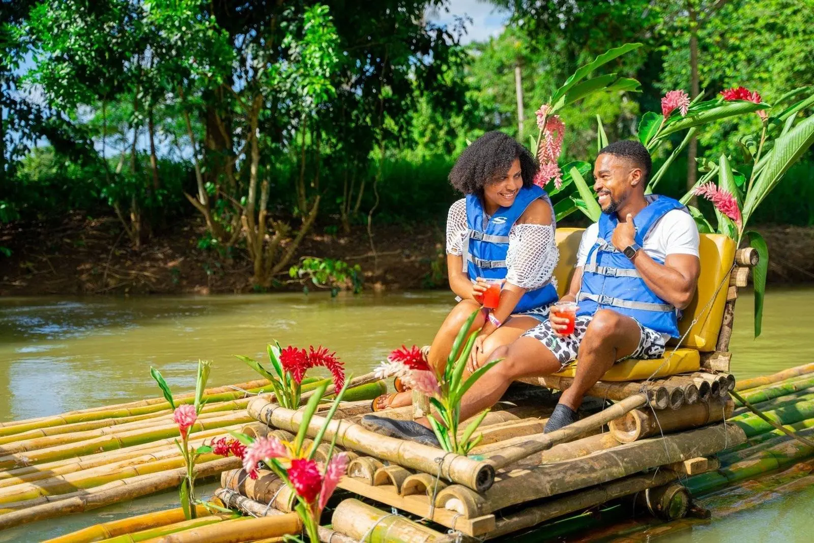 Guests enjoying a bamboo raft experience in Jamaica